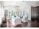 Bright living room features high ceilings, plantation shutters, and natural light, creating a comfortable and inviting space at 524 Tackett Farms Rd, Smyrna, GA 30082