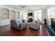 Cozy living room with built-in shelving, fireplace, and hardwood floors at 524 Tackett Farms Rd, Smyrna, GA 30082