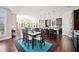 Open-concept living space combining dining, kitchen, and living areas with hardwood floors at 524 Tackett Farms Rd, Smyrna, GA 30082