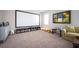 Spacious media room with a large screen, comfortable seating, and shelving at 524 Tackett Farms Rd, Smyrna, GA 30082