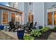 Lovely outdoor patio with chairs, plants, and plenty of sunshine is ideal for relaxing with Gathering and friends at 524 Tackett Farms Rd, Smyrna, GA 30082