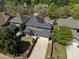 Aerial view of a home, showcasing its lush landscaping and surrounding neighborhood at 9988 Devonshire St, Douglasville, GA 30135