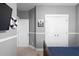 Cozy bedroom features soothing gray walls, white trim, and nautical decor, creating a serene and inviting space at 9988 Devonshire St, Douglasville, GA 30135