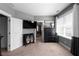 Spacious bedroom features a TV, dark wood accents, and soft carpeting, creating a comfortable and inviting atmosphere at 9988 Devonshire St, Douglasville, GA 30135