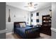 This bedroom has neutral walls, dark wood trim, carpeting, and nautical decor at 9988 Devonshire St, Douglasville, GA 30135