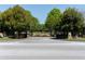 Community entrance featuring stone pillars and lush landscaping at 9988 Devonshire St, Douglasville, GA 30135