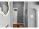 Hallway featuring hardwood floors, light gray paint and white trim at 9988 Devonshire St, Douglasville, GA 30135