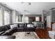 Open-concept living area adjacent to the kitchen with hardwood floors and neutral decor at 9988 Devonshire St, Douglasville, GA 30135