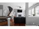 Inviting living room with fireplace, built-ins, and hardwood flooring with staircase detail at 9988 Devonshire St, Douglasville, GA 30135
