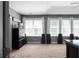 Spacious main bedroom with lots of natural light and tray ceilings at 9988 Devonshire St, Douglasville, GA 30135