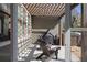 Covered patio with outdoor seating, a grill, and string lights overhead at 9988 Devonshire St, Douglasville, GA 30135
