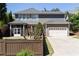 Back of the house with a large yard and a screened-in porch at 9988 Devonshire St, Douglasville, GA 30135