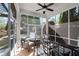 Relaxing screened-in porch with comfortable seating and a view of the outdoors at 9988 Devonshire St, Douglasville, GA 30135