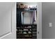 Organized walk-in closet with shelving, hanging rods, and ample storage for clothing and accessories at 9988 Devonshire St, Douglasville, GA 30135