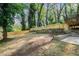 A large backyard featuring a new fence and tiered landscaping for visual interest at 1555 Olympian Sw Way, Atlanta, GA 30310