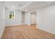 Finished basement area with modern flooring, white walls, and natural light at 1555 Olympian Sw Way, Atlanta, GA 30310
