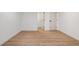 Finished basement area with light LVP flooring and multiple doorways at 1555 Olympian Sw Way, Atlanta, GA 30310