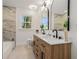 Bathroom featuring a dual vanity, marble counters and a bathtub at 1555 Olympian Sw Way, Atlanta, GA 30310