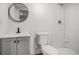Bathroom featuring a vanity with light grey cabinets and shower at 1555 Olympian Sw Way, Atlanta, GA 30310