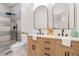 Contemporary bathroom with double vanity, wood cabinets, and sleek black hardware at 1555 Olympian Sw Way, Atlanta, GA 30310
