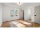 Sun-drenched bedroom with hardwood floors, multiple windows and closet at 1555 Olympian Sw Way, Atlanta, GA 30310
