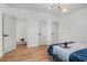 Bright bedroom featuring hardwood floors, natural light and an open closet at 1555 Olympian Sw Way, Atlanta, GA 30310