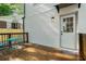 Charming deck with wood floors and a table and chairs sitting outside of a door to the home at 1555 Olympian Sw Way, Atlanta, GA 30310