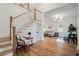Open floor plan with hardwood floors and staircase leading to the second floor at 1555 Olympian Sw Way, Atlanta, GA 30310