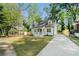 Beautifully maintained front yard and driveway showcasing this lovely home at 1555 Olympian Sw Way, Atlanta, GA 30310