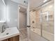 Modern bathroom features updated vanity and shower with marble style tile at 2633 Jonesboro Rd, Fairburn, GA 30213