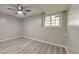 Bedroom featuring wood-look floors, a window, and a ceiling fan at 2633 Jonesboro Rd, Fairburn, GA 30213