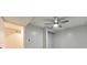 Bedroom featuring a ceiling fan and adjacent room at 2633 Jonesboro Rd, Fairburn, GA 30213