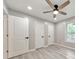 Bedroom featuring wood-look floors, a window, a ceiling fan, and closet at 2633 Jonesboro Rd, Fairburn, GA 30213