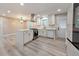 Open-concept kitchen with stainless steel appliances, a large island, and plenty of cabinet space at 2633 Jonesboro Rd, Fairburn, GA 30213