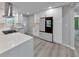Beautiful kitchen featuring stainless steel appliances, white cabinets, and plenty of countertop space at 2633 Jonesboro Rd, Fairburn, GA 30213