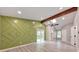 Spacious main bedroom featuring hardwood floors, a vaulted ceiling, and access to a private balcony at 2633 Jonesboro Rd, Fairburn, GA 30213