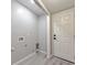 Mud Room/Laundry Room featuring a utility sink and a door to the backyard at 2633 Jonesboro Rd, Fairburn, GA 30213