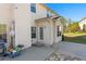 A backyard patio with outdoor furniture and a grassy yard at 3971 Busby Mill Ct, Ellenwood, GA 30294