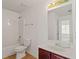 The bathroom is light and features a shower and tub combination and a single sink vanity at 3971 Busby Mill Ct, Ellenwood, GA 30294