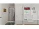 Bathroom with tub and glass enclosed shower at 3971 Busby Mill Ct, Ellenwood, GA 30294