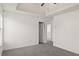 A bright bedroom with gray carpet flooring, white walls, and a white ceiling at 3971 Busby Mill Ct, Ellenwood, GA 30294