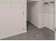 Walk-in closet with hanging racks and shelves at 3971 Busby Mill Ct, Ellenwood, GA 30294