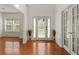 Bright foyer with hardwood floors, white trim and natural light filtering in at 3971 Busby Mill Ct, Ellenwood, GA 30294