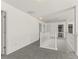 Upstairs hallway with white railings and neutral carpet, leading to multiple rooms at 3971 Busby Mill Ct, Ellenwood, GA 30294