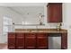 Kitchen showcasing granite countertops, stainless steel appliances, and dark wood cabinetry at 3971 Busby Mill Ct, Ellenwood, GA 30294