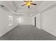 Main bedroom with tray ceiling, ceiling fan, and plenty of space at 3971 Busby Mill Ct, Ellenwood, GA 30294