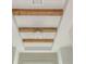Detailed ceiling with wooden beams and modern light fixture at 4496 Sardis Church Rd, Buford, GA 30519