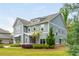 Charming two-story home with blue siding, white trim, and a well-maintained front yard at 4496 Sardis Church Rd, Buford, GA 30519