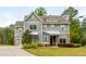 Charming two-story home with gray siding, manicured lawn, and inviting curb appeal at 4496 Sardis Church Rd, Buford, GA 30519
