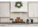 Close-up of kitchen countertops with stainless steel appliances and white subway tile backsplash at 4496 Sardis Church Rd, Buford, GA 30519